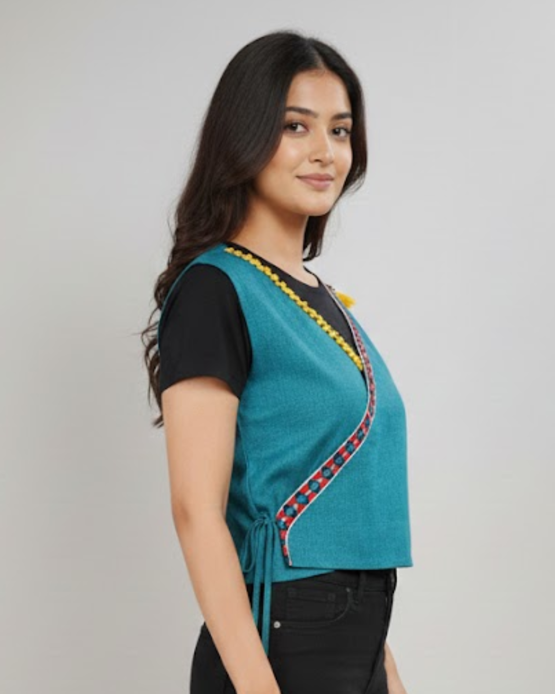 Wrap-style ethnic sleeveless blouse